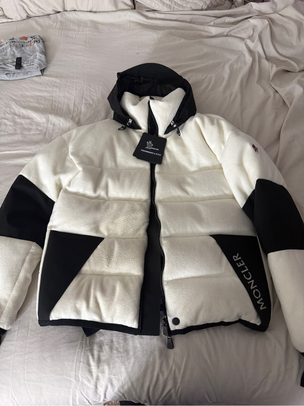 Moncler Black Jacket Interior with Cream Shearling Collar and Red Zip Accent